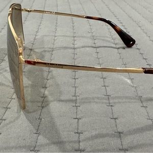 Max Mara sunglasses with yellow lenses and a gold frame. They are very cute.